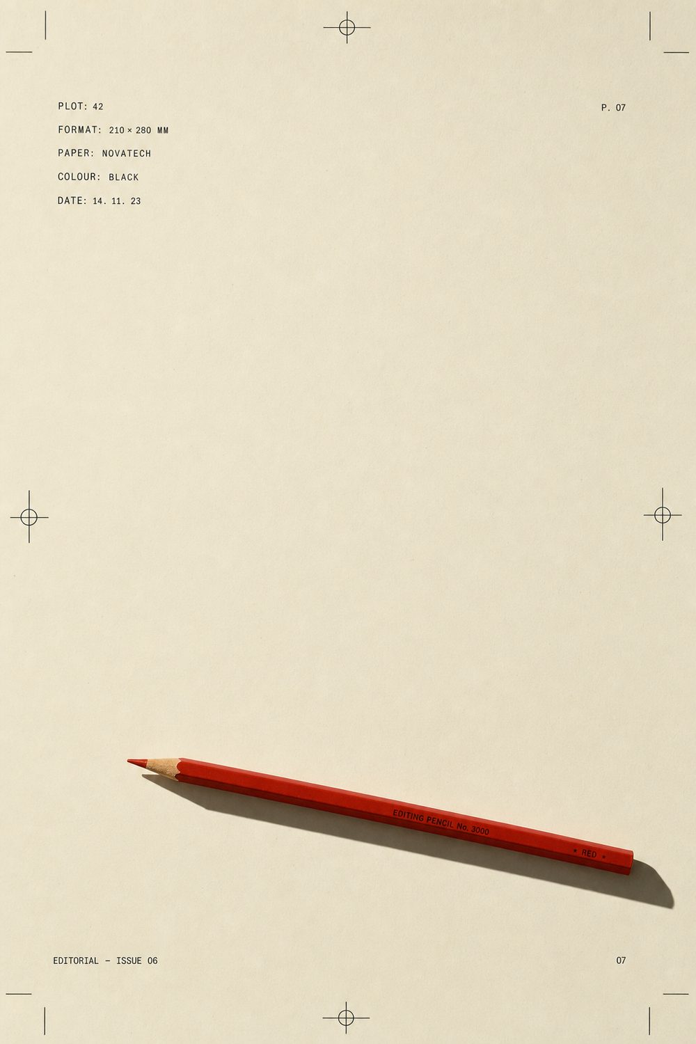 Red editing pencil on a cream proof sheet
